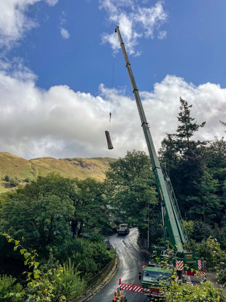 Lifting a section of tree using a straight or telescopic crane, Cumbria